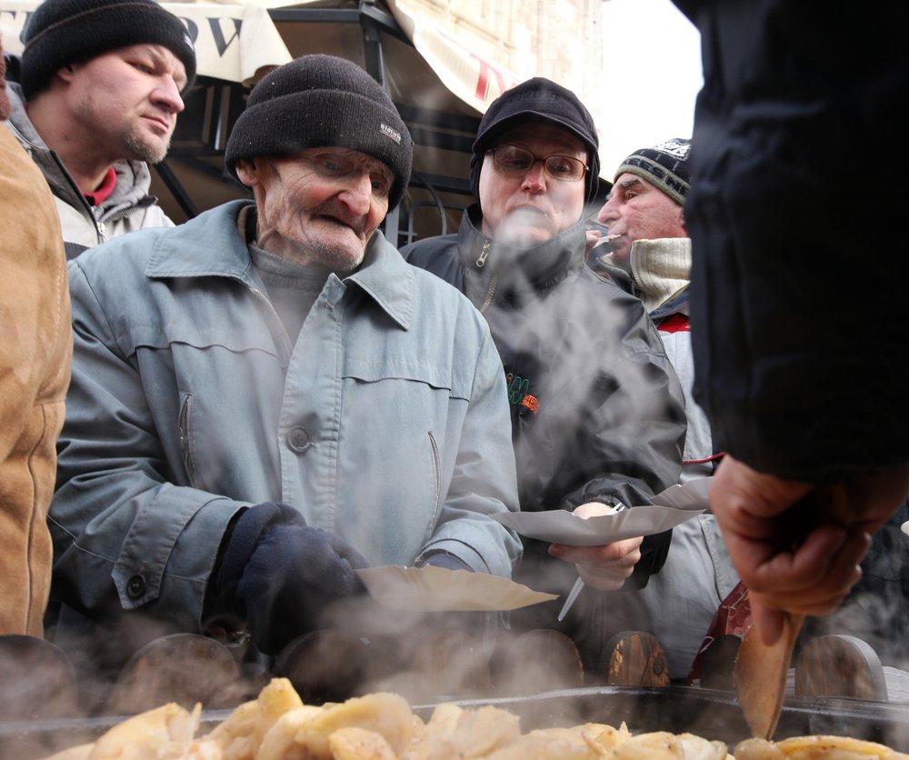 KRAKOW, POLAND - DECEMBER 19, 2010;  Christmas Eve for poor and homeless on the Central Market in Cracow. Every year the group Kosciuszko prepares the greatest eve in the open air in Poland.