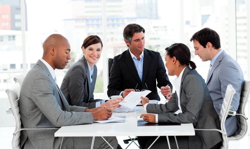 Multi-ethnic business people disscussing a budget plan in a meeting