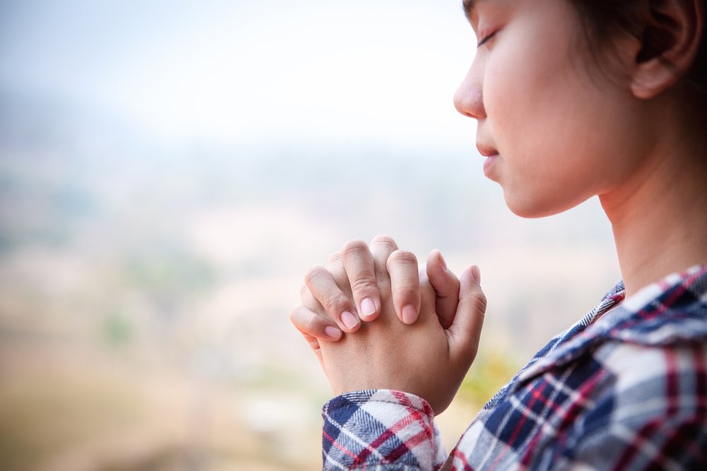 Christian woman  hands praying to god with morning,  Woman Pray for god blessing to wishing have a better life. Christian life crisis prayer to god.