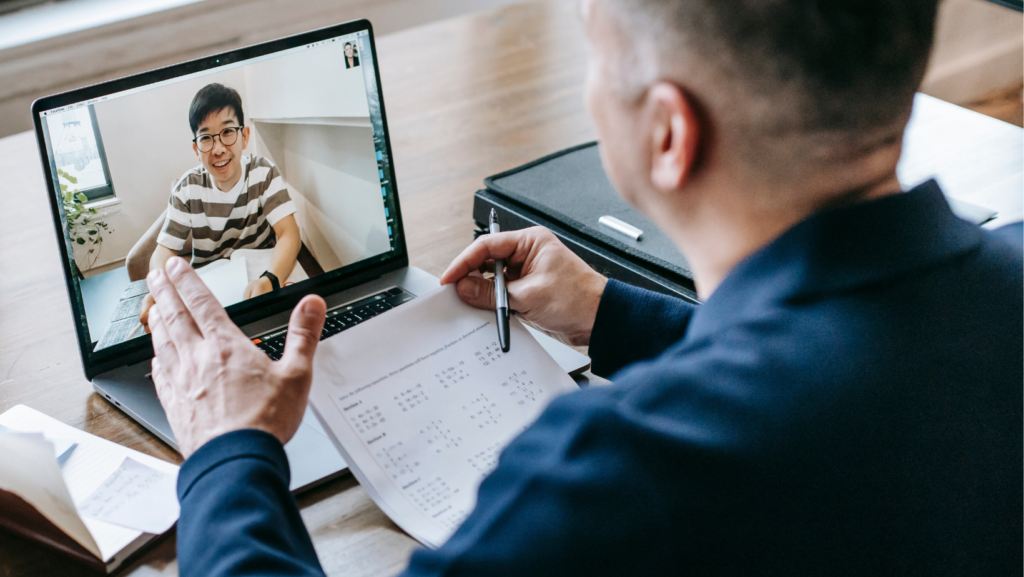 mentor teaching the student through video chat