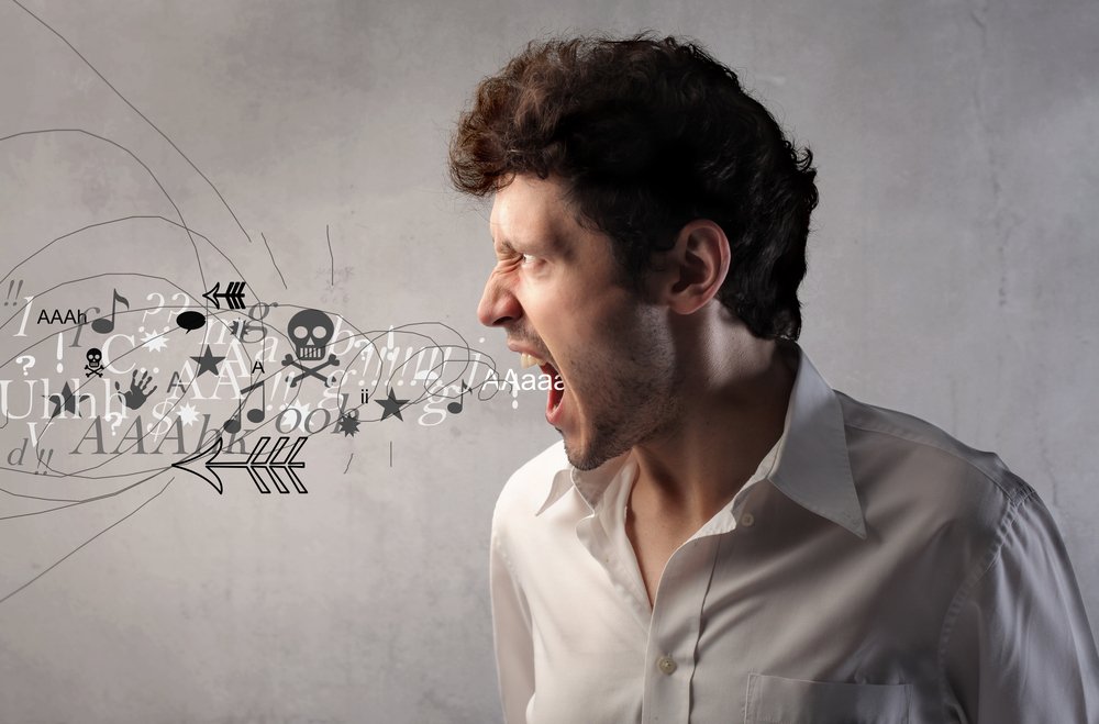 Angry man screaming with symbols and words coming out of his mouth