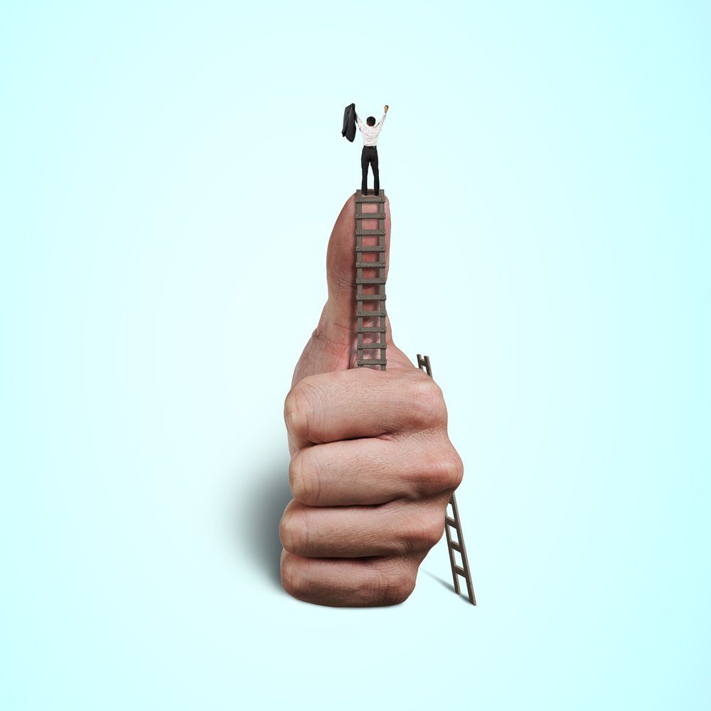 Cheering on top of thumb with wooden ladder