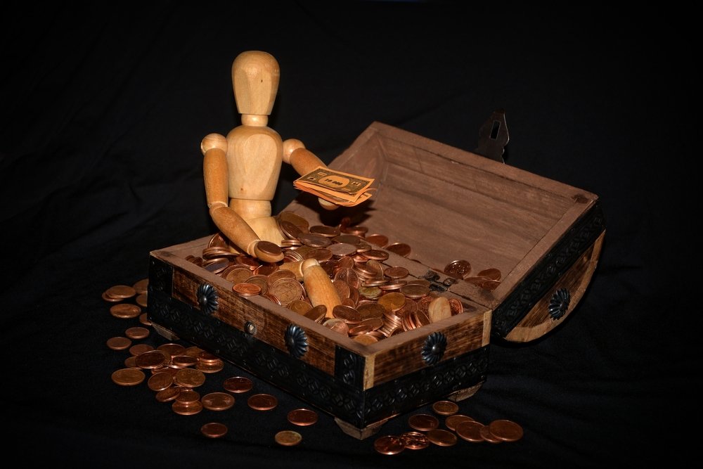 Wooden figure with a money box